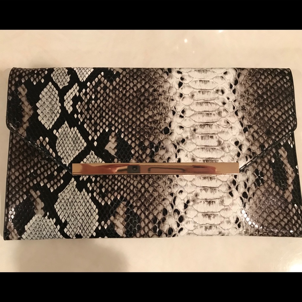 Faux snakeskin black and white clutch